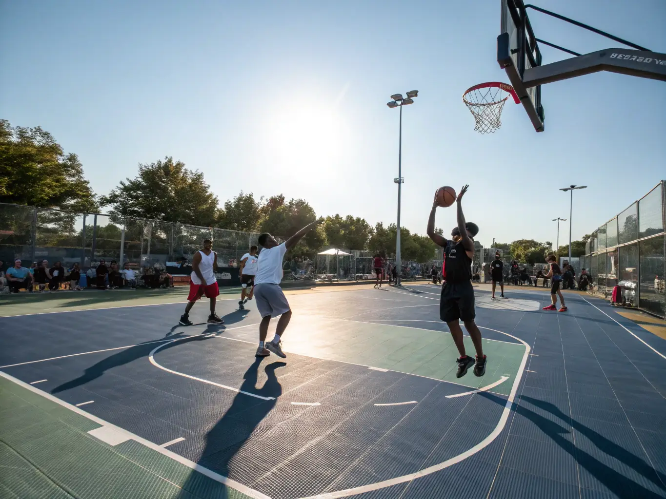 An action shot of adults playing basketball in a recreational league, emphasizing the fun and competitive spirit of FLASH'BALL SPORT's adult programs.
